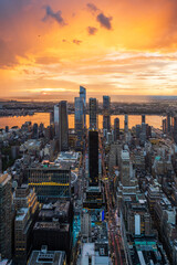 An incredibly colourful sunset during rainy storm over the Hudson Yards in New York City.