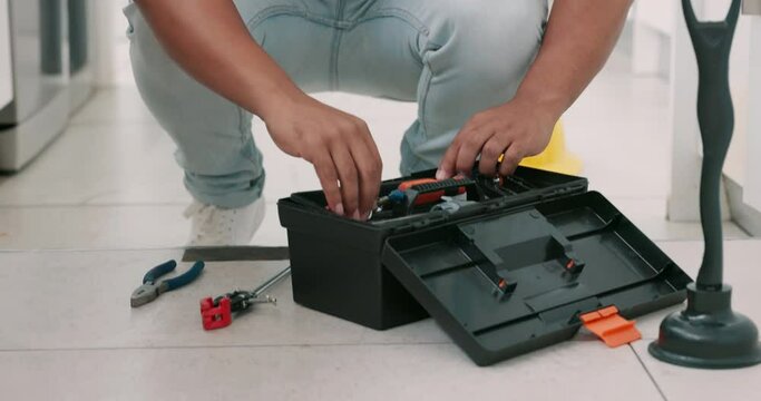 Repair, kitchen and man with box of tools for home construction, fixing and plumbing maintenance. Manual labor, DIY plumber and handyman pack equipment after working on sewer pipe, sink and plumbing