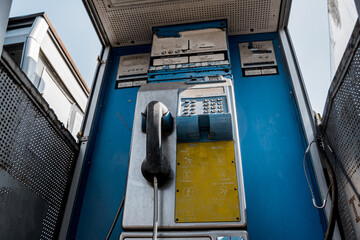Old and dirty street phones at the city landfill