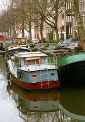 Fototapeta na wymiar Canal and barges - Amsterdam - The Netherlands