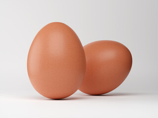 Two fresh chicken egg shots on white background