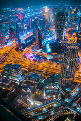 Fototapeta na wymiar Dubai, UAE. Dubai city at night, view with lit up skyscrapers and roads.