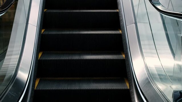 Close-up of an escalator for passengers or shoppers in a mall.
