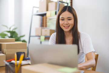 Asian woman preparing package delivery box Shipping for shopping online. young start up small business owner 