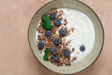 yogurt with chocolate muesli, with berries, blueberries, breakfast, close-up, fork on top, no people,