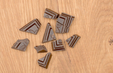Pieces of chocolate isolated on a white background . Top view. Flat lay