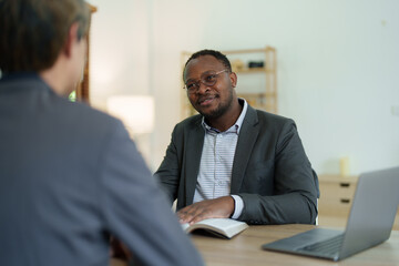 african american attorney, lawyers discussing contract or business agreement at law firm office,...