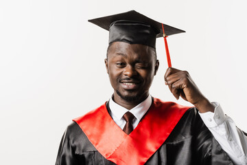 Portrait of graduate african man graduated from university and got master degree. Graduation. Happy...
