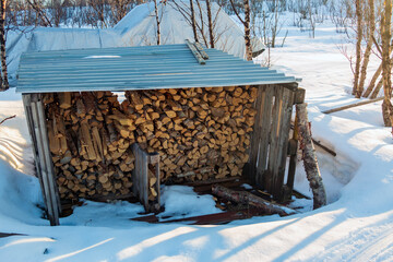 Abisko in Lapland in Sweden. Sunset at frozen Tornetrask Lake. Sun, snow, ice, the Arctic Circle, a landscape of northern Europe