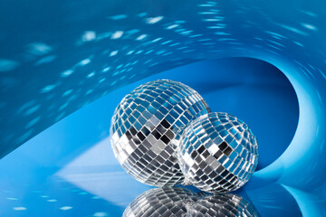 Bright shiny mirror disco balls reflecting light. Holidays concept.