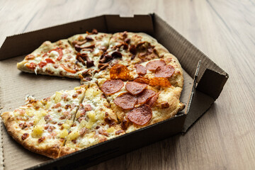 pizza slices in a cardboard box