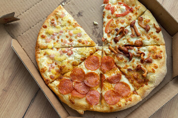 pizza slices in a cardboard box