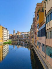 March 2023, Girona, Catalonia. Hanging houses of Onyar, Girona. Panoramic view of the river and old town of the Catalan city of Girona. Facades of the historic center of the town on the river.