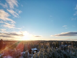 swedish nature and landscape shots with snow, sun, ski jump, lakes