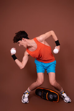 Retro style. A young attractive guy is doing aerobics.