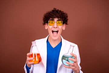 Crazy young scientist makes experiments in the office.