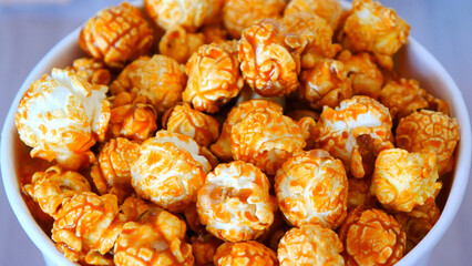 Close-up of beautiful caramel popcorn in a cardboard cup