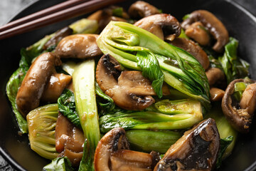 Bok Choy or Pak Choi and Mushroom Stir Fry in vegetarian sauce. Healthy vegan food. - obrazy, fototapety, plakaty