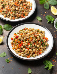 Chickpea Salad with Quinoa, sweet red pepper, herbs and lemon. Healthy food