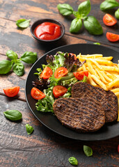 Peppered Vegetarian steaks served with french fries and salad