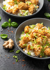 Kung Pao Cauliflower with rice, peanuts and spices. Healthy vegan food.