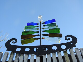 symbolic boat with a sail made of bottles