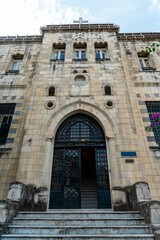 Antioch protestant church entrance door in Antakya's old town with beautiful flowers in front before 2023 Turkey–Syria earthquake. - obrazy, fototapety, plakaty