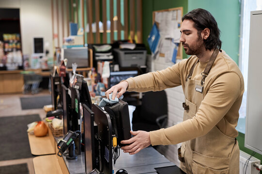 Portrait Of Bearded Male Worker In Supermarket Cleaning Cashiers Station, Copy Space