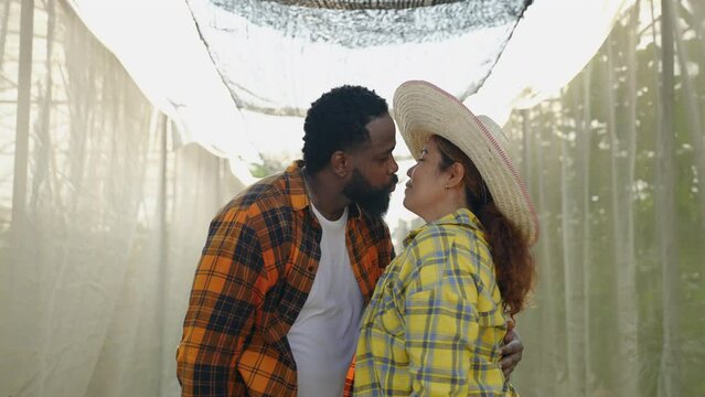 Farmer couple kissing in love who endure hardships and hardships together, encourage each other, family relationship concept
