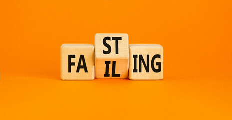 Fasting or failing symbol. Concept word Fasting Failing on wooden cubes. Beautiful orange table orange background. Business, healthy lifestyle and fasting or failing concept. Copy space.