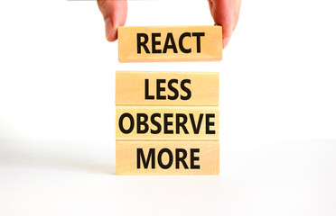 React less observe more symbol. Concept words React less observe more on wooden block. Beautiful white table white background. Motivational business react less observe more concept. Copy space.