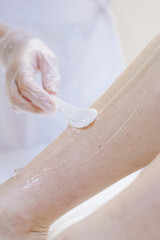 Naklejka premium shaving leg with laser. beauty treatment
