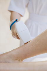 shaving leg with laser. beauty treatment