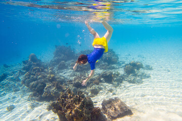Child snorkeling. Kids underwater. Beach and sea.
