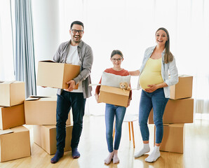Fototapeta na wymiar child family box home house moving happy apartment pregnant mother father daughter relocation new property parent pregnancy