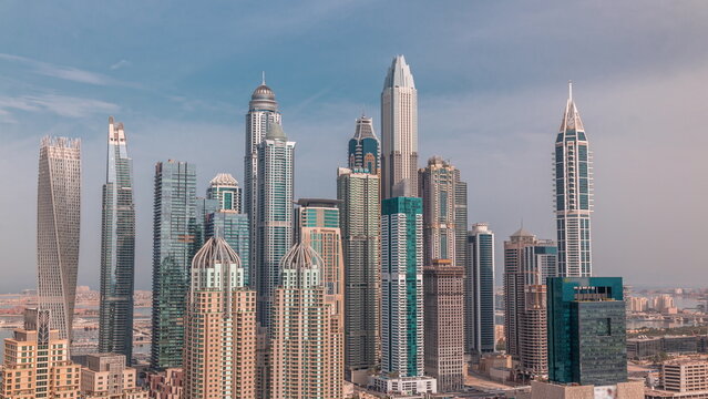 Skyscrapers of Dubai Marina near Sheikh Zayed Road with highest residential buildings morning timelapse © neiezhmakov