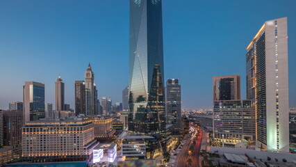 Plakat Dubai International Financial district aerial day to night timelapse. Panoramic view of business and financial office towers.