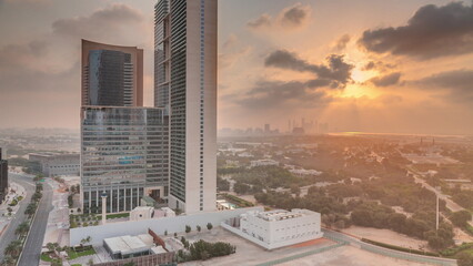 Dubai International Financial district aerial night to day timelapse. View of business office towers.