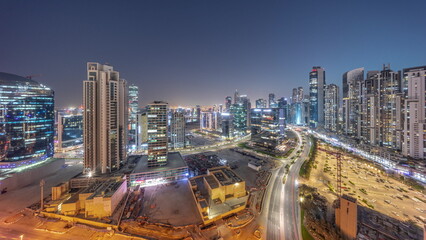 Fototapeta na wymiar Business Bay with modern towers residential development aerial panoramic day to night timelapse, Dubai