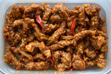 Crispy beef with sweet and chilli sauce.  Traditional Chinese food. 