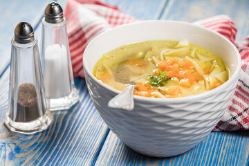 Broth - chicken soup in a bowl.