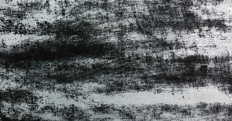 black lino ink remain, linocutting paint roller texture on white wall.