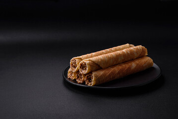 Delicious crispy wafer rolls with cream filling with nuts