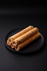 Delicious crispy wafer rolls with cream filling with nuts