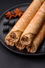 Delicious crispy wafer rolls with cream filling with nuts