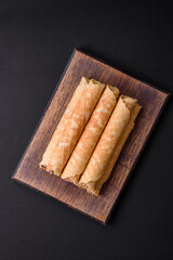 Delicious crispy wafer rolls with cream filling with nuts