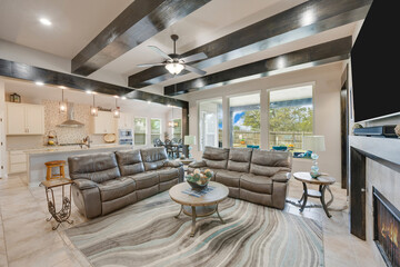 a living room with wood beams