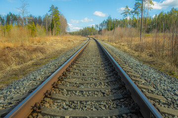 Railway tracks for a train. Railway tracks in a rural scene. Industrial landscape with railroad....