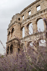 Vertical View of Pula Arena with Cloudy Sky. Roman Amphitheatre with Arch Windows in Croatia.