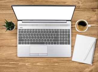 Top view wooden desk with blank display laptop, notepad, coffee and green plant. Modern workplace